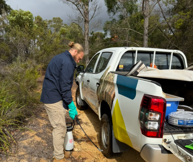 South West NRM Program Manager Environment Tom Andrews cleaning down a vehicle as part of field hygiene procedures